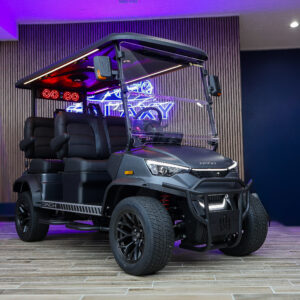 Black Dach electric golf cart with premium seats and full windshield at Galaxy Golf Cars showroom