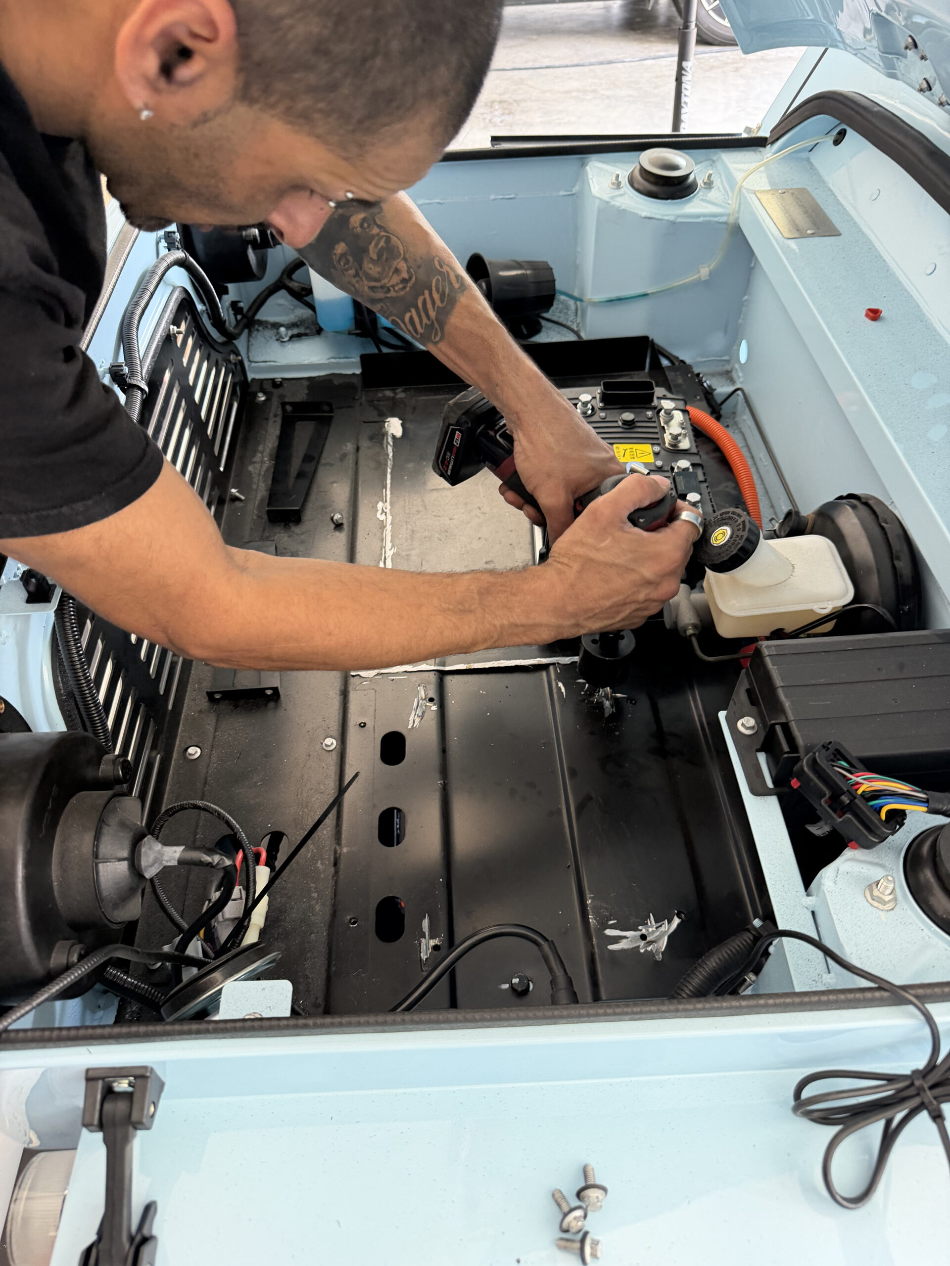 Galaxy technician servicing a golf cart