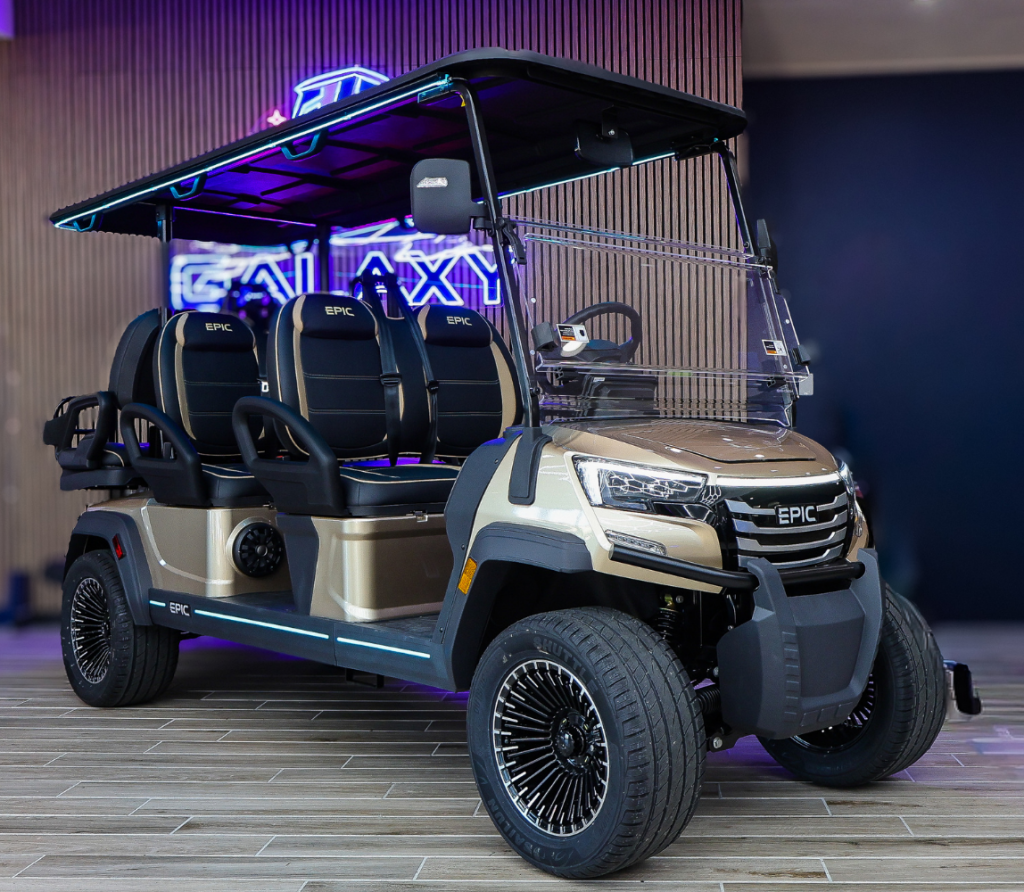 Gold Epic E60FX 6-passenger golf cart in the Galaxy Golf Cars showroom with LED lighting